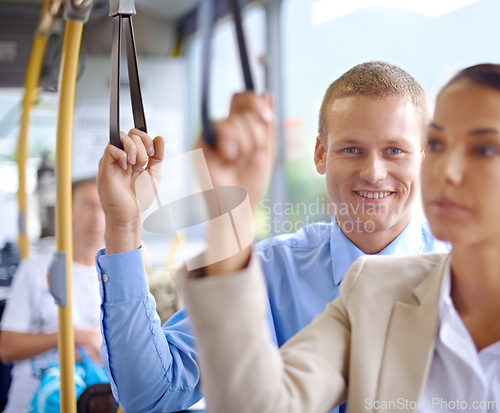 Image of Man, happy and standing on public transportation or bus, journey and travel to work in city. Male person, smile and trip or transit on metro, traffic and passenger or standing in motor vehicle