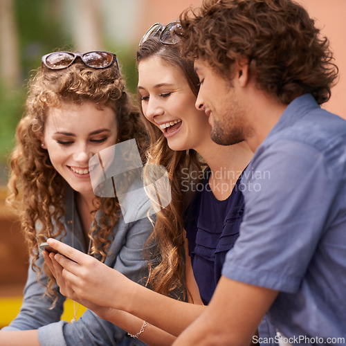 Image of Friends, laughing and talking with cellphone for social media, internet and text. Young people, conversation and humor with tech for online and scrolling for memes, comedy and laughter with app