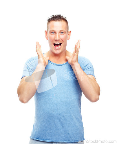 Image of Portrait, man and shock for surprise, good news and announcement in studio on white background. Excited, happy and male person with smile for hearing, wow, and amazing story, gossip and scoop