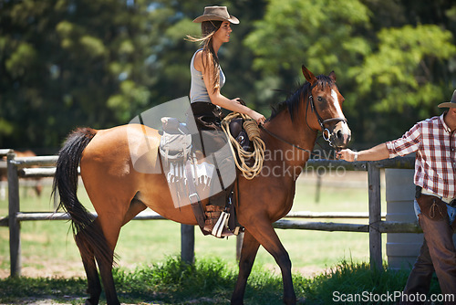 Image of Female woman, horse and farm with cowboy, stable and ranch in Texas for pony riding. Stallion, mare and animal paddock for equestrian learning, countryside and lessons for sports for beginner rider