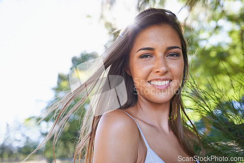 Image of Woman, farm and portrait in sunshine, nature park and smile on holiday in summer break outdoor. Female person, countryside and happy by tree, vacation and ranch at amazon forest for relaxation