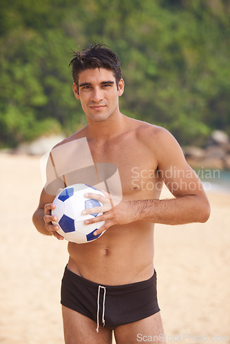 Image of Beach, portrait and shirtless man with soccer ball in nature for fun summer, weekend break or outdoor vacation. Ocean, swimwear and male person by football for adventure, happiness and sunshine.