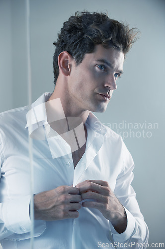Image of Businessman, morning and shirt button ready for office work, corporate and professional with confidence or proud. Male person, fashion and dressing while thinking, job and company for career