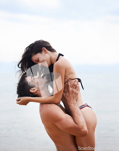 Image of Couple, beach and ocean with love, smile and romance with swimwear and bikini. Man, woman and date with holiday, vacation and adventure with nature for cape town summer travel and happiness for trip