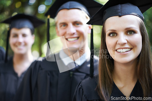 Image of Student, portrait and graduation with woman and friends outdoor at university, college and study ceremony. Education, campus and class at certificate, degree and school event with smile together