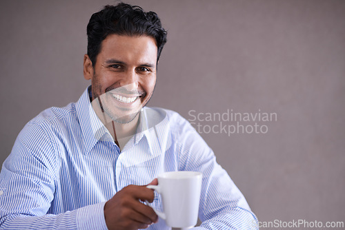 Image of Indian businessman, coffee and smile portrait on work break, professional and happy isolated on grey background. Stock broker, finance and accounting or management at firm, investment and corporate