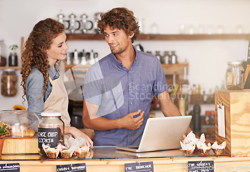 Image of Laptop, collaboration in coffee shop with man and woman small business owner team planning for opening. Computer, smile and teamwork with people together in startup cafe for strategy or discussion