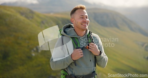 Image of Happy man, face and backpack with mountain in nature for hiking, adventure or outdoor journey. Male person, tourist or hiker smile with bag for trekking, sightseeing or fresh air on cliff or hills