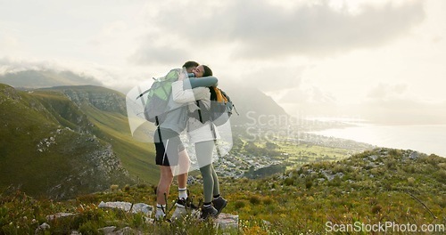 Image of Couple, high five and hiking on mountains for success, support and travel achievement or goals in nature. Happy people hug with love for outdoor journey and trekking in backpack on eco friendly hills