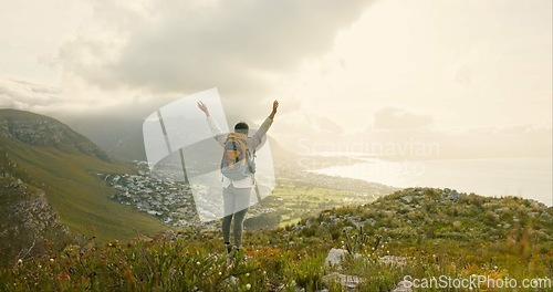 Image of Woman, hiking on mountain top and freedom or success of travel goals, trekking adventure and nature. Back of hiker or winner in backpack and arms up, celebration or achievement on cliff and cityscape