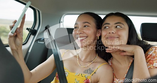 Image of Woman, friends and selfie on road trip with smile, tongue and funny face with adventure in car. Girl, photography and kiss with care, journey or holiday with memory, profile picture or transportation