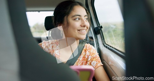 Image of Woman, smartphone and road trip in car with laugh, meme and comic video on internet on road for travel. Girl, phone and reading in vehicle with funny blog, social media post or story with transport