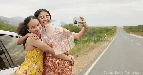 Image of Women, friends and selfie by car on road trip with memory, profile picture and happy with kiss in countryside. Girl, photography and together with hug, bonding and care for post on social network