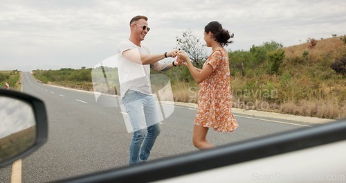 Image of Nature, dancing and young couple on road trip in countryside listening to music together. Happy, love and man and woman moving to song, playlist or radio by car on vacation, adventure or holiday.