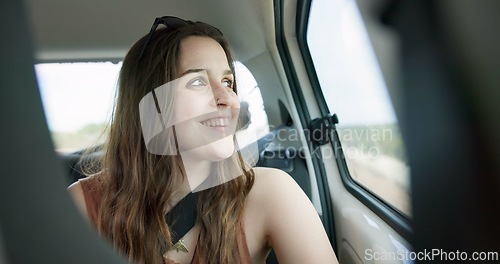 Image of Thinking, smile and young woman in a car on a road trip for adventure, journey or vacation. Happy, reflection and female person from Australia with memory by window in vehicle for holiday transport.