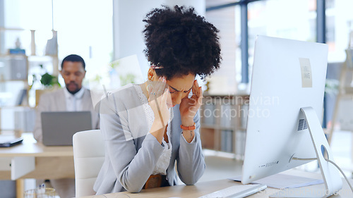 Image of Frustrated woman, headache and stress with anxiety at office in burnout, depression or mental health. Female person or young employee with migraine, strain or pressure in fatigue or pain at workplace