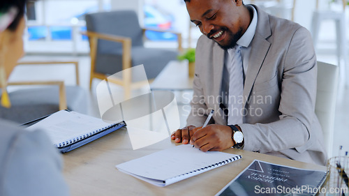 Image of Black man, writing and documents with contract for signature, deal or agreement on office desk. African businessman, employee or intern filling out form, application or paperwork in recruit or hiring
