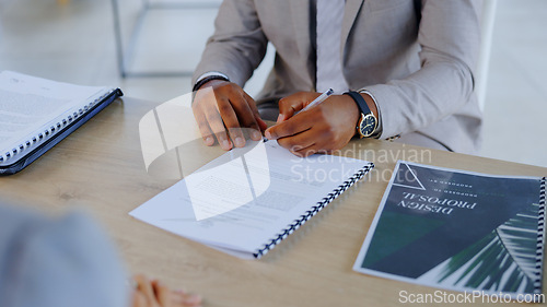 Image of Business person, hands and writing with documents for contract, signing or signature on office desk. Closeup of employee or intern filling out form, application or paperwork for hiring at workplace