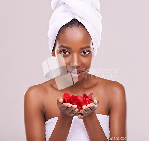 Image of Portrait, skincare and black woman with red petals, cosmetics and dermatology on a white studio background. Face, African person and model with natural beauty and grooming with treatment and luxury
