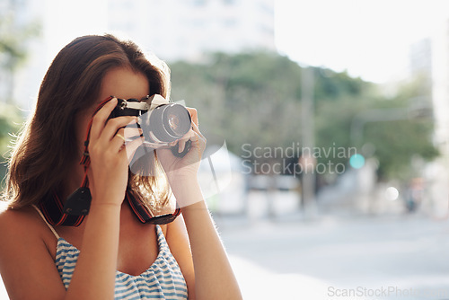 Image of Woman, photography and city street with camera for photo, memory or capturing outdoor moment. Female person, tourist or photographer taking picture with lens for sightseeing or travel in urban town