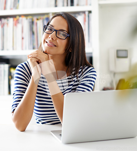 Image of Portrait, woman and smile of student on laptop in home for remote learning, study or distance education at table. Face, glasses and happy person on computer at desk with online technology in Brazil