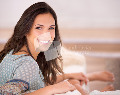Image of Portrait, couch or happy woman in a house to relax on holiday in hotel, home or apartment living room. Lady, sofa or female person with smile, wellness or confidence on vacation break to rest alone