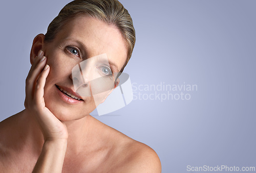 Image of Face, beauty and space with mature woman in studio on gray background for aesthetic wellness. Skincare, relax and mock up with natural skin person at spa for antiaging cosmetics or treatment