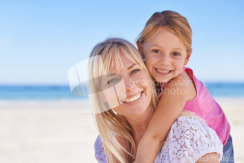 Image of Portrait, mother and happy kid on beach for holiday, summer or vacation on mockup space with piggyback. Face, mom and smile of girl at ocean for adventure, travel or family bonding together outdoor