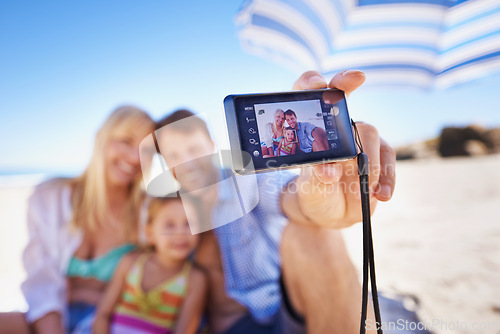 Image of Happy family, beach and selfie with camera for photography, picture or moment in outdoor nature. Mother, father and child with smile for photo, capture or bonding memory together on the ocean coast