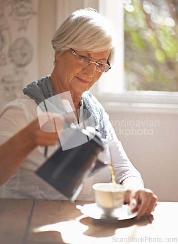 Image of Senior, woman and tea in home for morning, brunch or calm routine in retirement, holiday or vacation. Mature, person and pouring liquid on coffee break or relax in apartment with drink at window