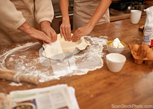 Image of Hands, food and couple baking in kitchen of home together closeup with ingredients for recipe. Cooking, dough or flour with husband and wife in apartment for fresh pastry preparation from above