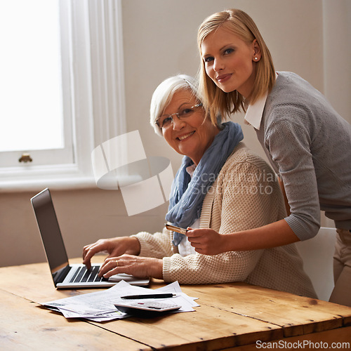 Image of Granddaughter, grandmother and help with laptop for budget, finance and technology with advice and assistance. Women pay bills online, life insurance or tax paperwork with retirement and portrait