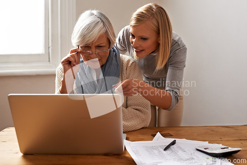 Image of Granddaughter, grandmother and help with laptop for online payment, finance and technology with advice on budget. Women pay bills, life insurance or tax paperwork with retirement and assistance