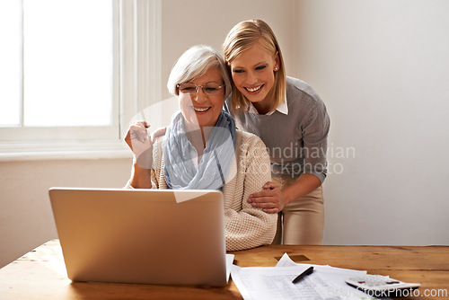 Image of Woman, senior mother and laptop for finance in home, support and help for ecommerce on website. Daughter, old person and paperwork for tax return, investment and teaching on tech for online banking