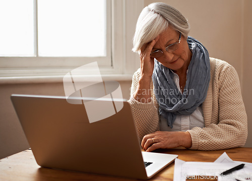 Image of Senior woman, stress and laptop for finance in home, worry and paperwork for tax return or insurance. Elderly female person, frustrated and documents for retirement plan, fail and mistake in budget