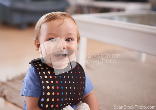 Image of Boy, baby and smile in portrait at home, joy and curious or relax in living room on floor. Child development, happy kid and calm or comfortable, wellness and toddler for health and positive growth