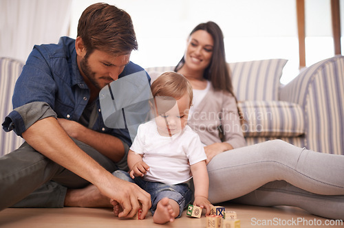 Image of Father, baby and building blocks on floor, support and growth or development toys for teaching play in living room. Happy family, dad or interactive game for child or learning of motor skills in home