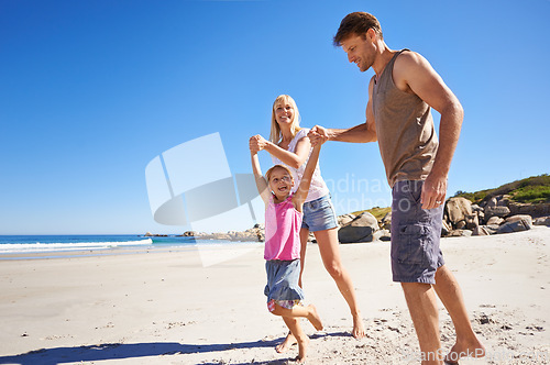 Image of Love, holding hands and happy family at a beach with swing, support and care while bonding in nature. Freedom, travel and kid with parents at the ocean for morning games, fun or adventure at the sea