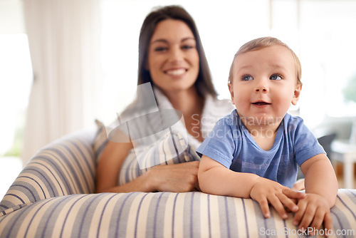 Image of Mother, baby and relax in portrait on couch, care and support or smile in living room and comfortable. Mommy, son and love for bonding in childhood, single parent and happy for childcare on weekend