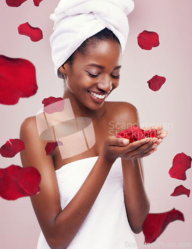 Image of Portrait, dermatology and black woman with red petals, cosmetics and luxury on a white studio background. Face, African person and model with natural beauty and grooming with treatment and aesthetic