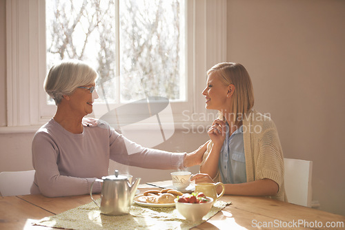 Image of House, woman and daughter visit mom in kitchen with food for breakfast, tea and snacks with senior. Female person, smile and happiness with mother in family home, elderly and girl in dining room