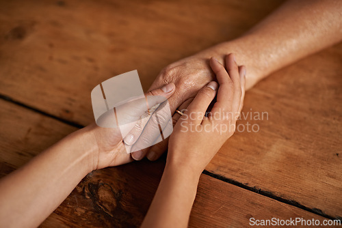 Image of Closeup, people and hands with empathy or support for grief, comfort and compassion by table in home. Sympathy, family and praying together for gratitude, healing and kindness with trust and care