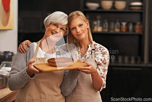 Image of Portrait, happy woman and elderly mother with pie in kitchen, cooking or smile of family showing homemade food together in house. Face, daughter or senior mom with dessert, pastry or help with baking