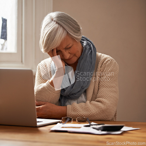 Image of Senior woman, stress and laptop for bills in home, worry and paperwork for tax return or insurance. Elderly female person, frustrated and documents for retirement plan, fail and mistake in budget