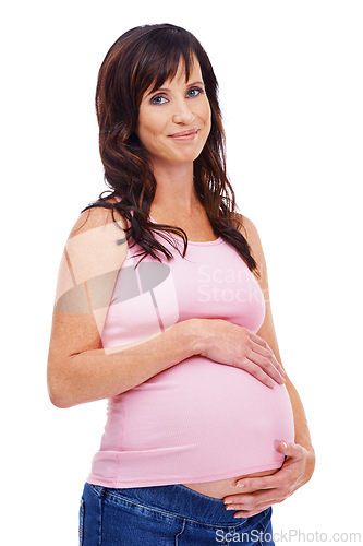 Image of Portrait, pregnant and smile with belly of woman in studio isolated on white background for expecting. Baby, care and love of pregnancy with happy young parent touching stomach for motherhood