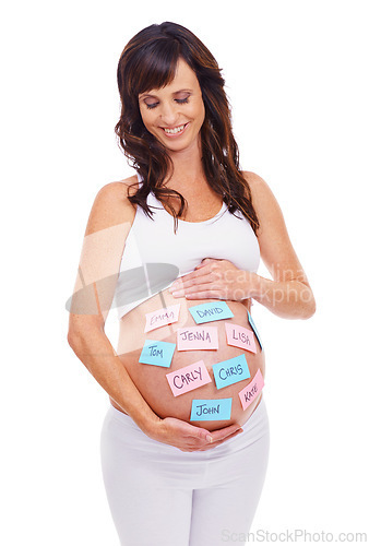 Image of Smile, names and sticky notes on stomach of pregnant woman in studio isolated on white background. Love, choice or decision and happy young prenatal mother with idea on belly or tummy for maternity