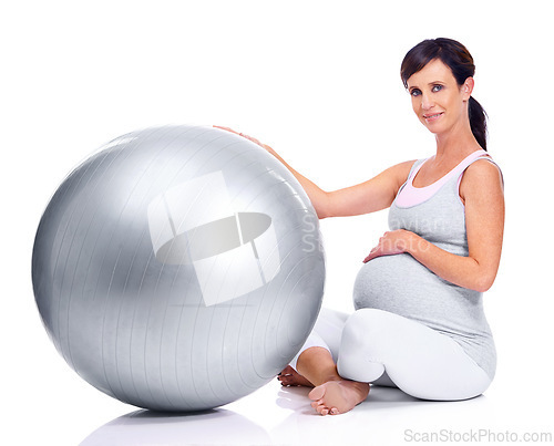 Image of Pregnant female person, ball and studio for final trimester, wellness and exercise for motherhood. Maternal woman, workout and white background for health, fitness and pregnancy to keep in shape