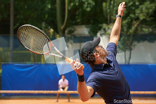 Image of Fitness, sports and tennis with man serving on court to start match for competition or game from back. Exercise, health or training and man with racket at stadium or venue for beginning of tournament