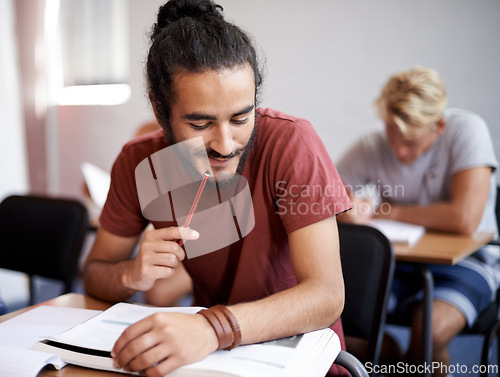 Image of Man, reading and class with books for thinking, test and solution at university student with education. Person, learning and assessment with ideas, pencil and studying for development in college hall