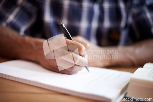 Image of Student, hand and writing notes in university, learning and knowledge on college campus. Education, person and closeup of information for exams, planning and scholarship for studying or revision
